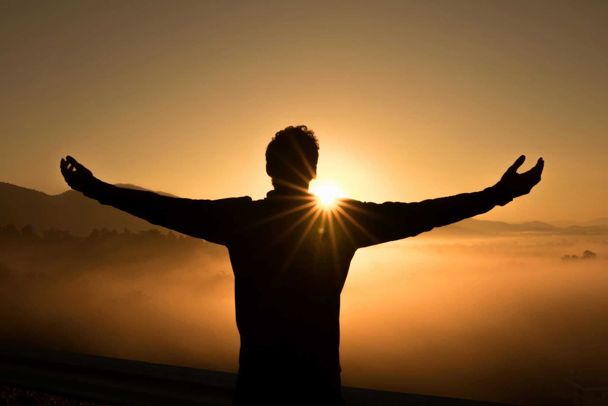 Arms open at sunrise